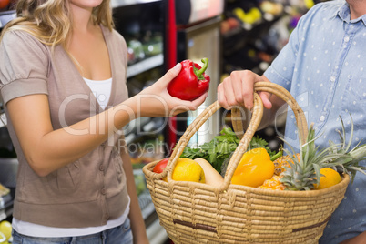 Bright couple buying differents vegetables