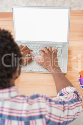 Young businessman typing on the laptop