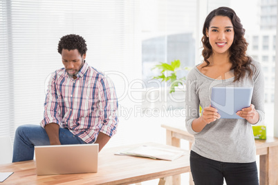 Young business people smiling at the camera