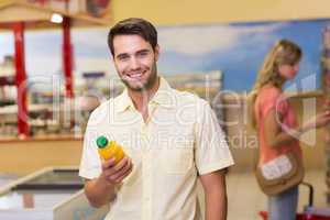 Portrait of a smiling handome man buying products