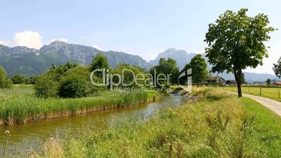 Sunny landscape with river in the Bavarian Alps