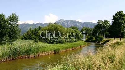 Sunny landscape with river in the Bavarian Alps