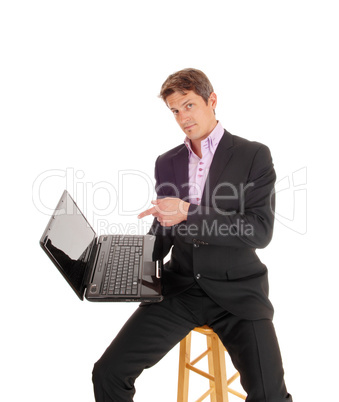 Business man showing on laptop. Business man showing on laptop.