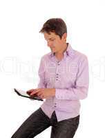 Man playing with tablet pc.