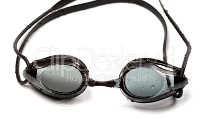 Wet goggles for swimming on white background
