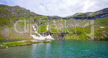 Idyllic view of Balea Lake shore in Fagaras Mountains