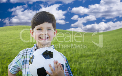 Cute Boy with Soccer Ball in Park