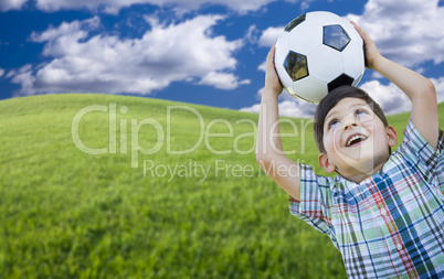 Cute Boy with Soccer Ball in Park
