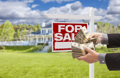 Man Handing Over Money in Front House For Sale, Sign