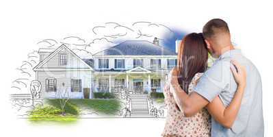 Military Couple Looking At House Drawing and Photo on White