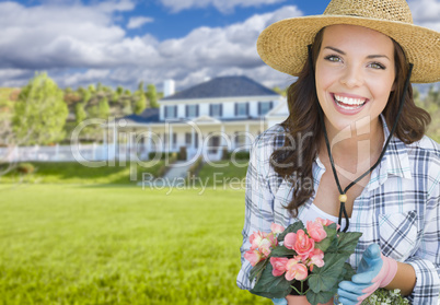 Young Woman Gardening in Front of Beautiful House