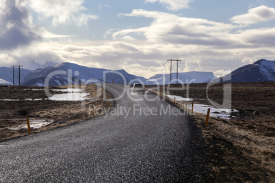 Snowy volcano landscape with dramatic clouds in Iceland