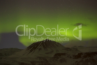 Northern lights with snowy mountains in the foreground