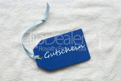 Gutschein Means Voucher On Blue Label Sand