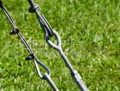 Pair of tightened metal loops and cables