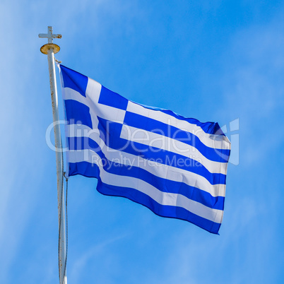 Greek flag floating in the blue sky of Cyprus