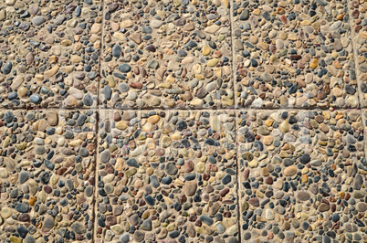 Floor paved with pebbles and stone tiles