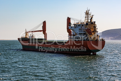 Cargo Ship Sailing in Ocean