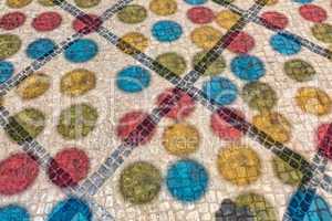 Multicolored Shadows from Decorative Balls on Paving Stone