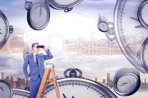 Composite image of businessman looking on a ladder