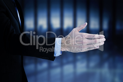 Composite image of businessman ready to shake hand