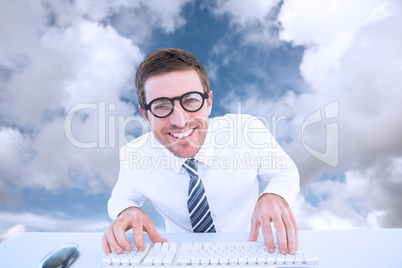 Composite image of businessman working at his desk Composite image of businessman working at his desk