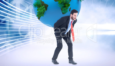 Composite image of businessman carrying the world