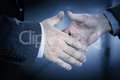 Composite image of two people going to shake their hands