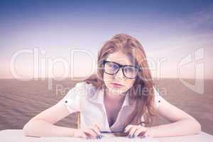 Composite image of pretty redhead typing on keyboard