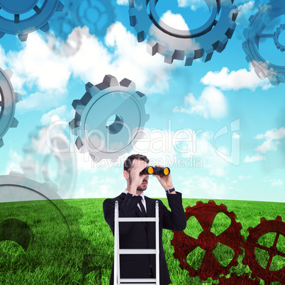 Composite image of businessman looking on a ladder