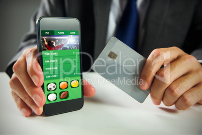 Composite image of businessman using smartphone Composite image of businessman using smartphone
