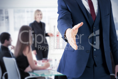Composite image of businessman ready to shake hand