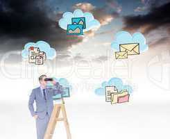 Composite image of businessman looking on a ladder