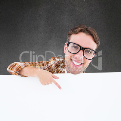 Composite image of nerdy businessman pointing to poster