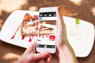 Composite image of hand holding smartphone