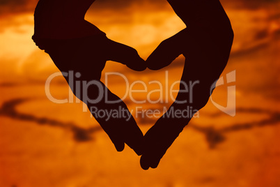 Composite image of close up of hands forming heart Composite image of close up of hands forming heart