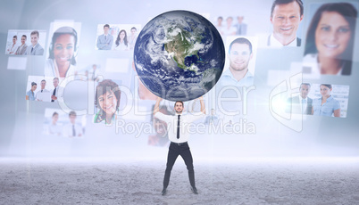 Composite image of businessman carrying the world