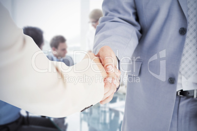 Composite image of people in suit shaking hands