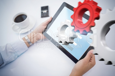 Composite image of man using tablet pc