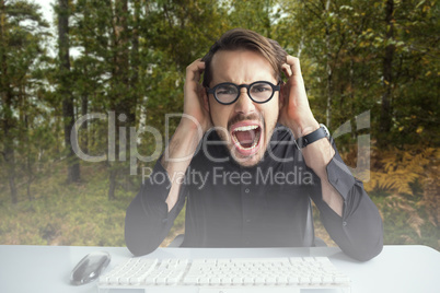 Composite image of businessman yelling with his hands on face