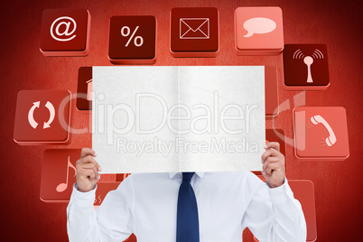 Composite image of tradesman holding blank sign in front of his