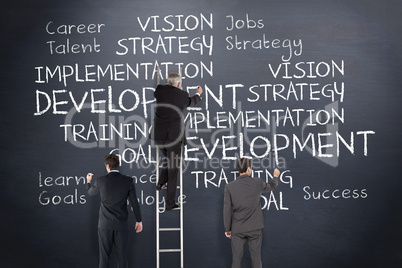 Composite image of business team writing