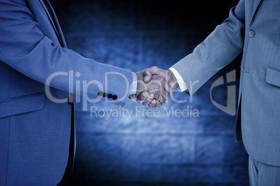 Composite image of side view of shaking hands