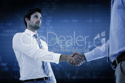 Composite image of two businessmen shaking hands in office