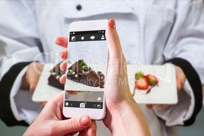 Composite image of hand holding smartphone