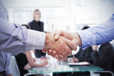 Composite image of men shaking hands