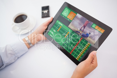 Composite image of man using tablet pc