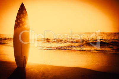 surf board standing on the sand