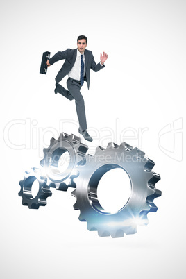 Composite image of stern businessman in a hurry