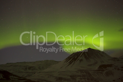 Northern lights with snowy mountains in the foreground